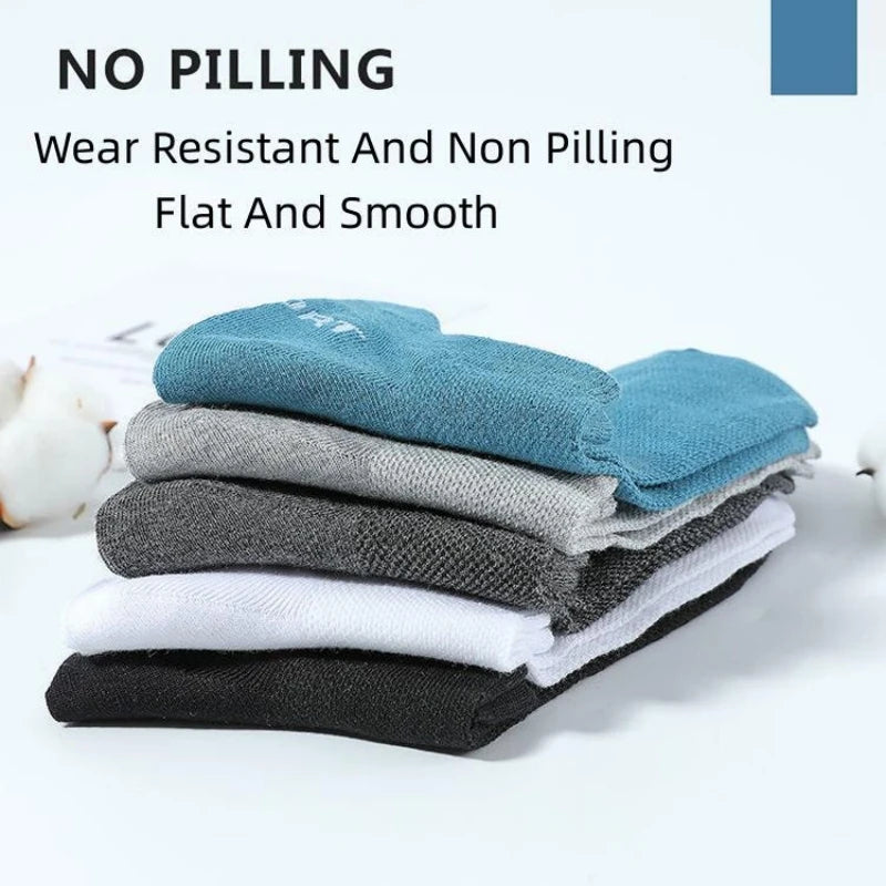 Set of five high-quality gray ankle socks for men by Corporación Turística, shown laid out flat with soft fabric texture.