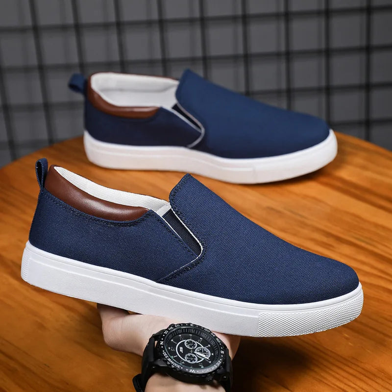 Gray Feerldi men's casual lightweight shoes by Corporación Turística, showing the slip-on sneaker with a textured sole.