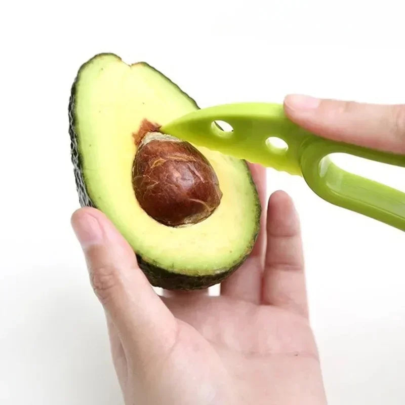 Green 3-in-1 avocado tool kit by Corporación Turística with slicer, pitter, and scoop for easy avocado preparation.
