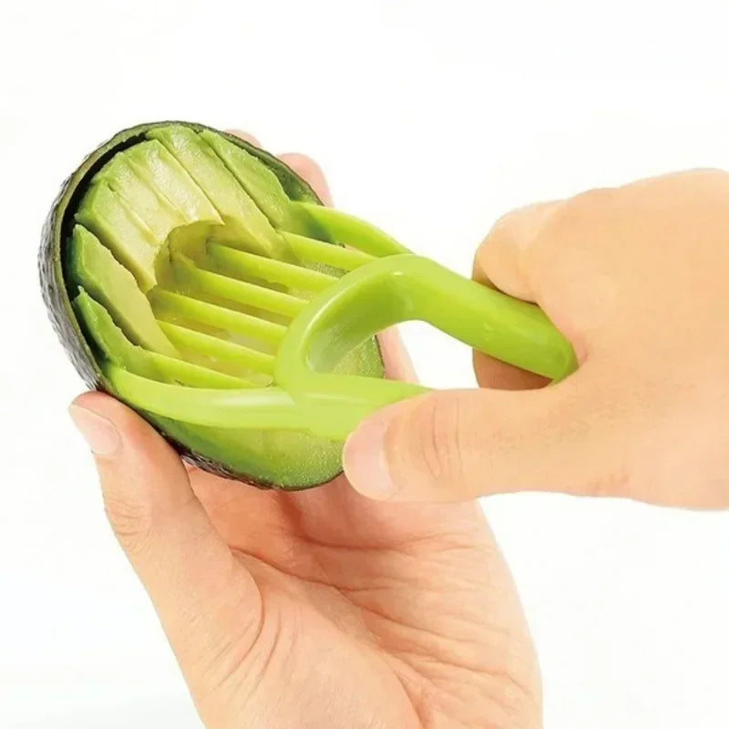 Green 3-in-1 avocado tool kit by Corporación Turística, includes slicer, pitter, and cutter for easy avocado preparation.