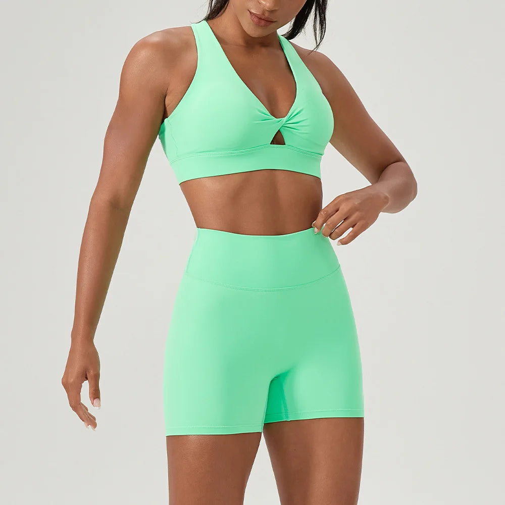Green Naked Yoga Set by Corporación Turística featuring a sexy sports bra and matching yoga leggings.