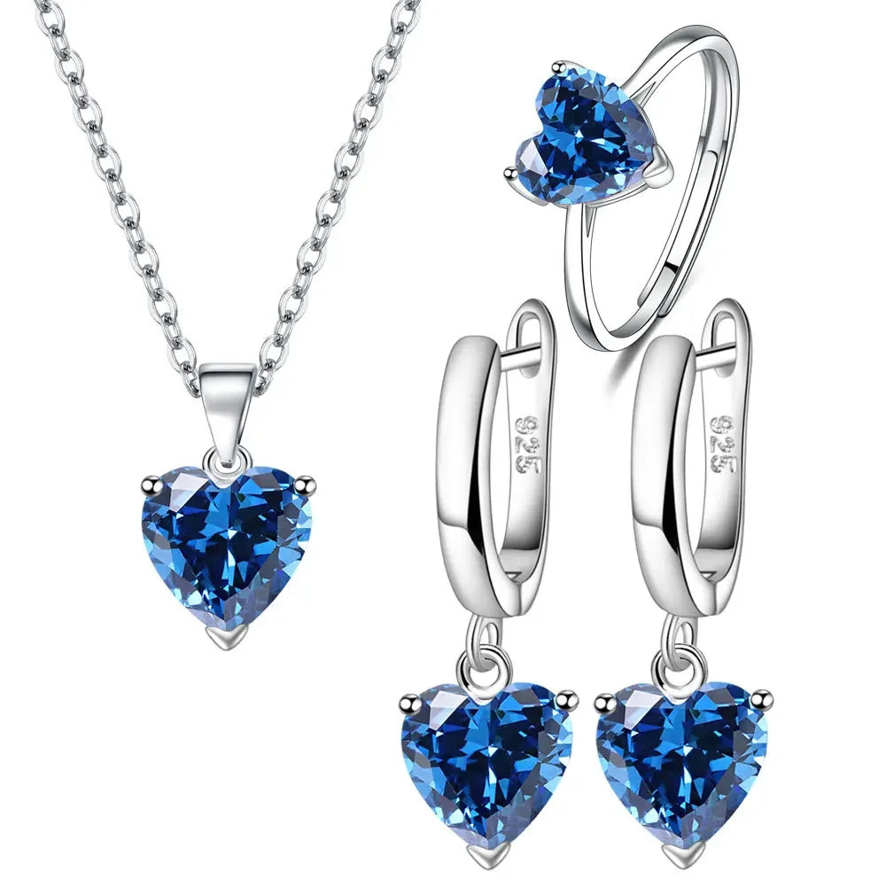 Silver jewelry set for women by SAIYE, featuring a necklace and earrings in 925 sterling silver with intricate design details.