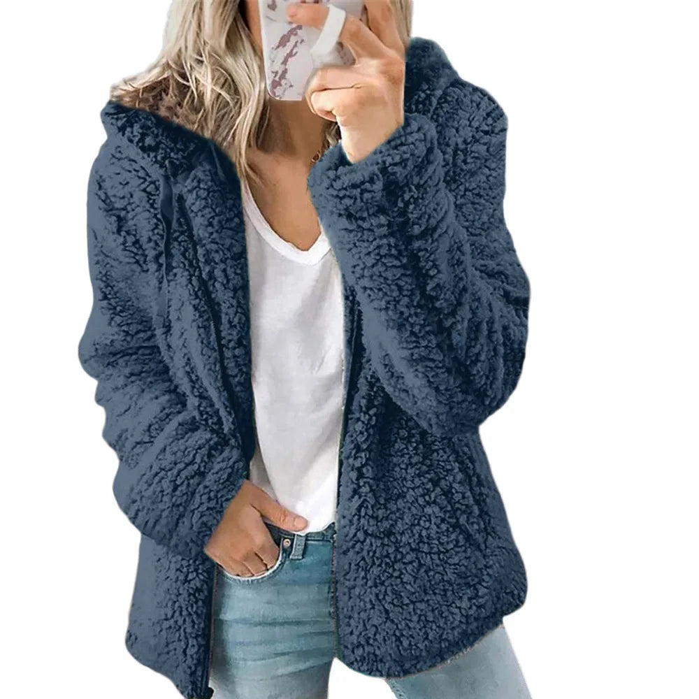Dark gray velvet tweed women's hooded jacket by Corporación Turística, shown on a mannequin, with a relaxed fit and textured fabric.