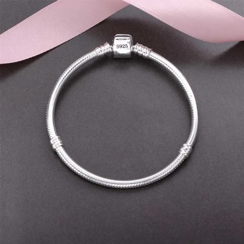 Handmade fine jewelry silver bracelet by Corporación Turística, showcasing intricate design and polished silver finish.