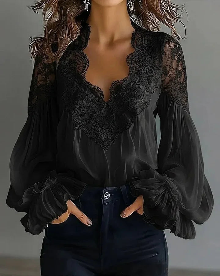 White lace blouse with deep V-neck and long sleeves from Corporación Turística, detailed lace fabric and elegant design.