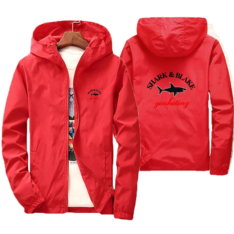 Colorful men's and women's waterproof jacket with hood by Corporación Turística, ideal for rainy weather and outdoor activities.