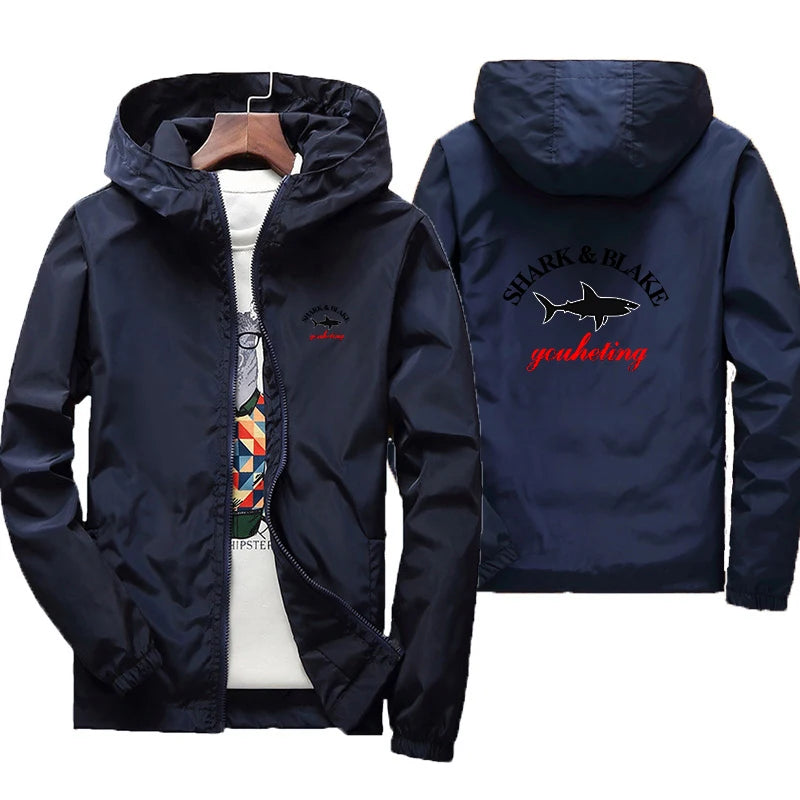 Colorful waterproof jacket with hood for men and women by Corporación Turística, featuring a lightweight, weather-resistant design.