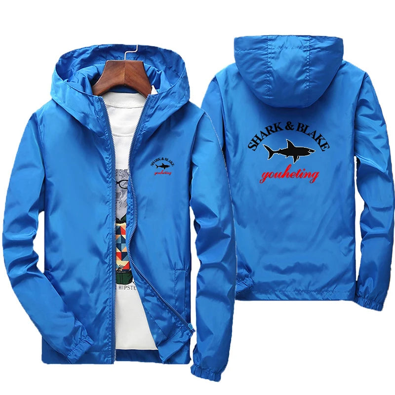Colorful unisex waterproof jacket with hood from Corporación Turística, suitable for men and women, designed for rain protection.