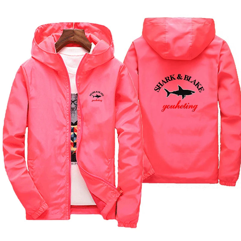 Colorful waterproof hoodie jacket for men and women by Corporación Turística, designed for rain protection and outdoor activities.