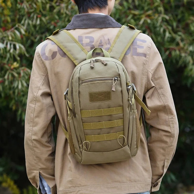 Khaki tactical mini backpack by Corporación Turística, 10L/20L capacity for outdoor travel and hiking adventures.