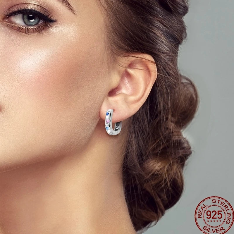 Colorful sterling silver 925 earrings with circular design, featuring vibrant hues, by Corporación Turística.