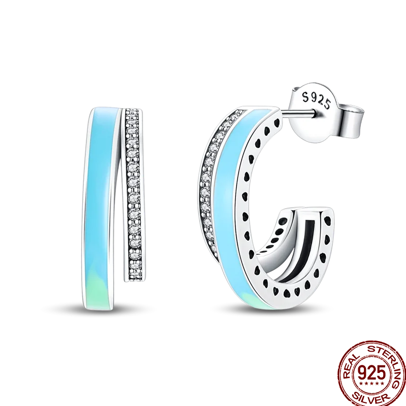 Colorful sterling silver 925 earrings featuring circus-inspired designs, crafted by Corporación Turística.