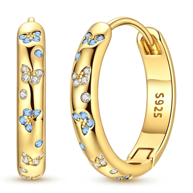 Sterling silver hoop earrings from Corporación Turística, stylish and original jewelry featuring 925 silver craftsmanship.