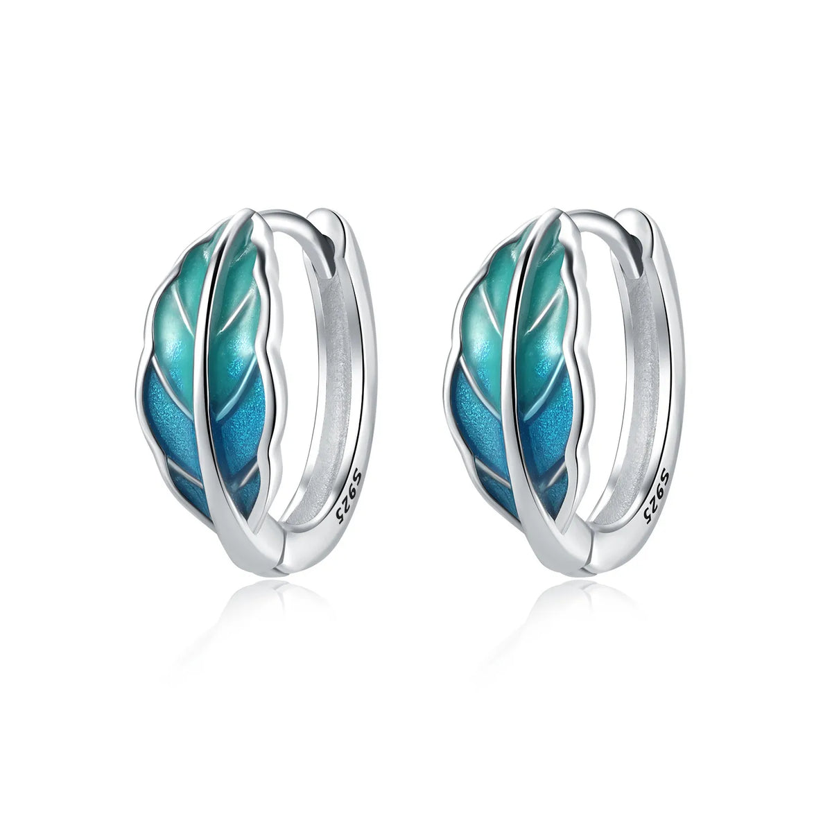 Silver hoop earrings with leaf and flower design, crafted by Corporación Turística featuring intricate botanical details.