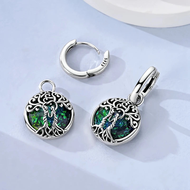 Sterling silver 925 earrings with cubic zirconia featuring an intricate tree design, crafted by Corporación Turística.