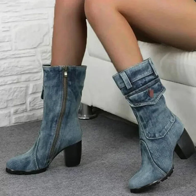 Light blue women's cowboy boots with heels, featuring traditional Western style and decorative stitching by Corporación Turística.