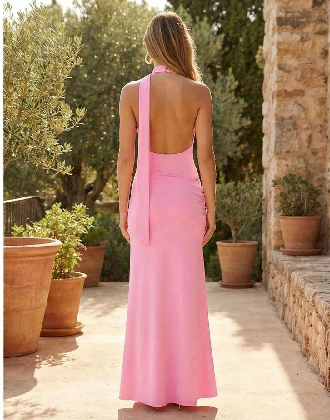 Elegant long halter dress for women in brown, sleeveless, from Corporación Turística, displayed on a mannequin.