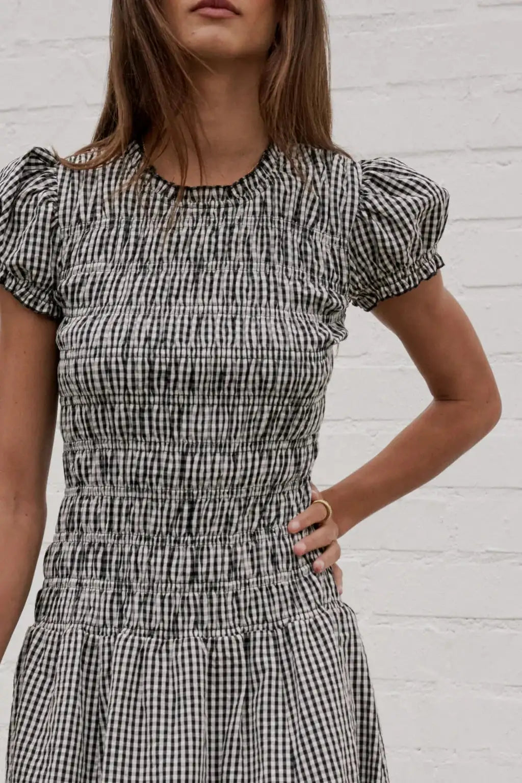 Elegant brown smocked dress for women with a floral print, stylish and comfortable, from Corporación Turística.