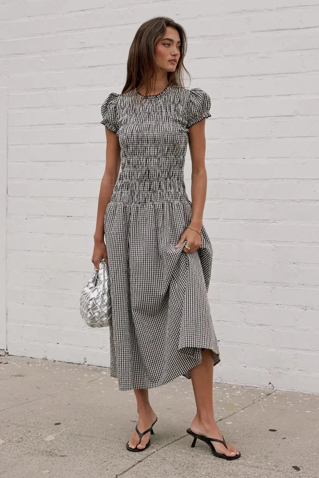 Elegant women's smocked dress with floral print by Corporación Turística, featuring a stylish and comfortable fit.