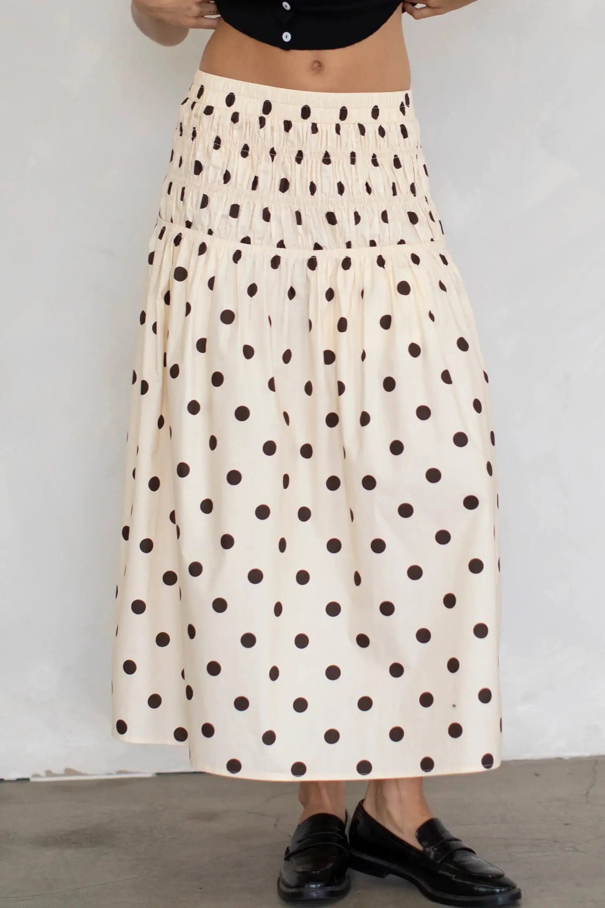 Long chiffon skirt with elastic waistband and printed pattern, featuring a flowy design in a warm brown color by Corporación Turística.