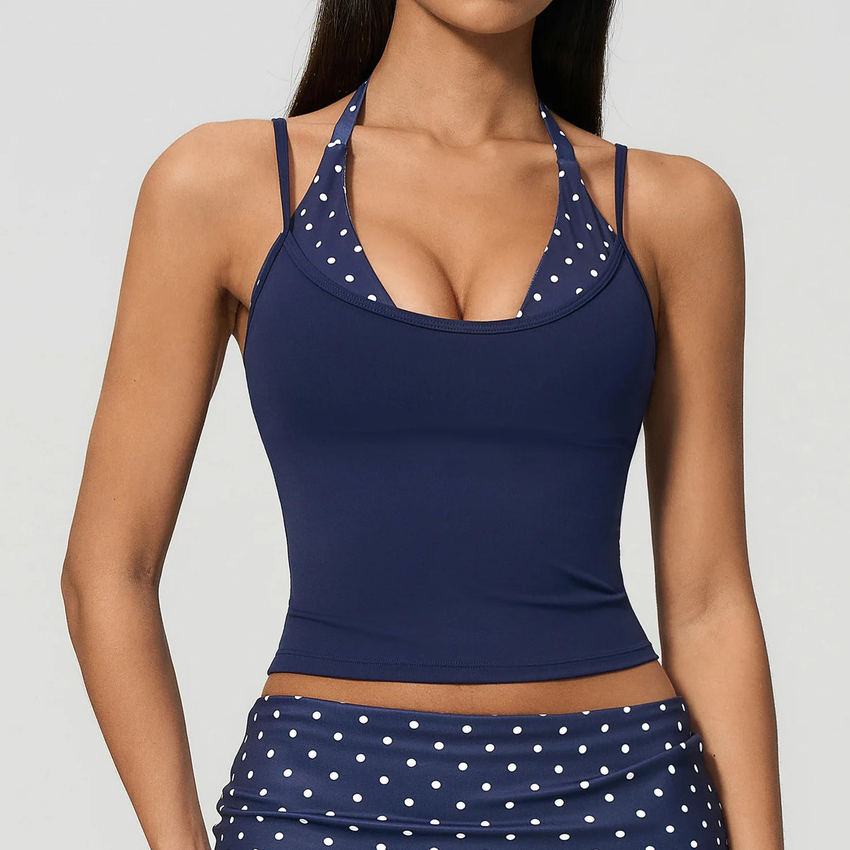 Yellow and white striped yoga top with built-in anti-chafe sports bra by Corporación Turística, perfect for active wear.