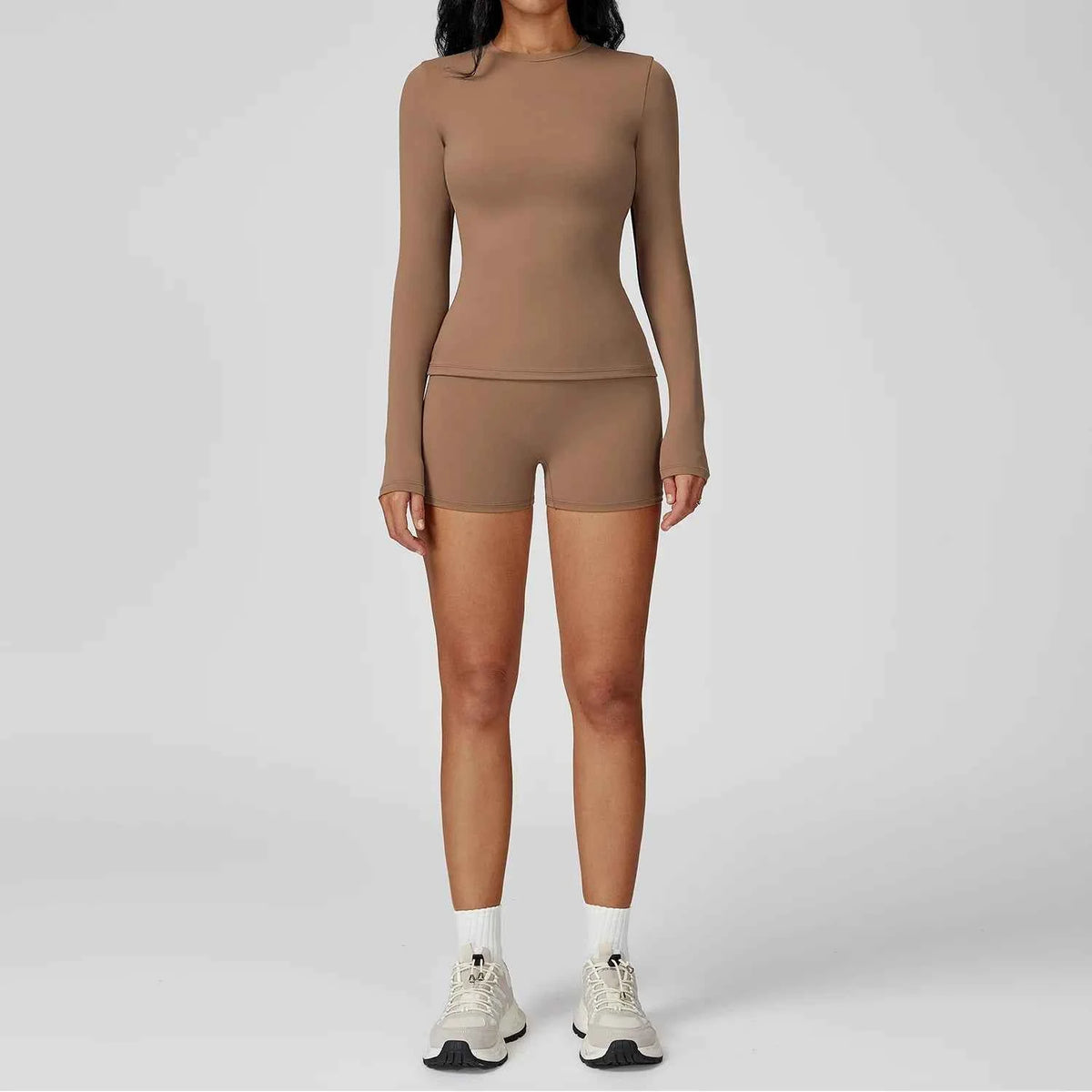 Mocha brown yoga set with two pieces from Corporación Turística, featuring comfortable sportswear for active exercise.