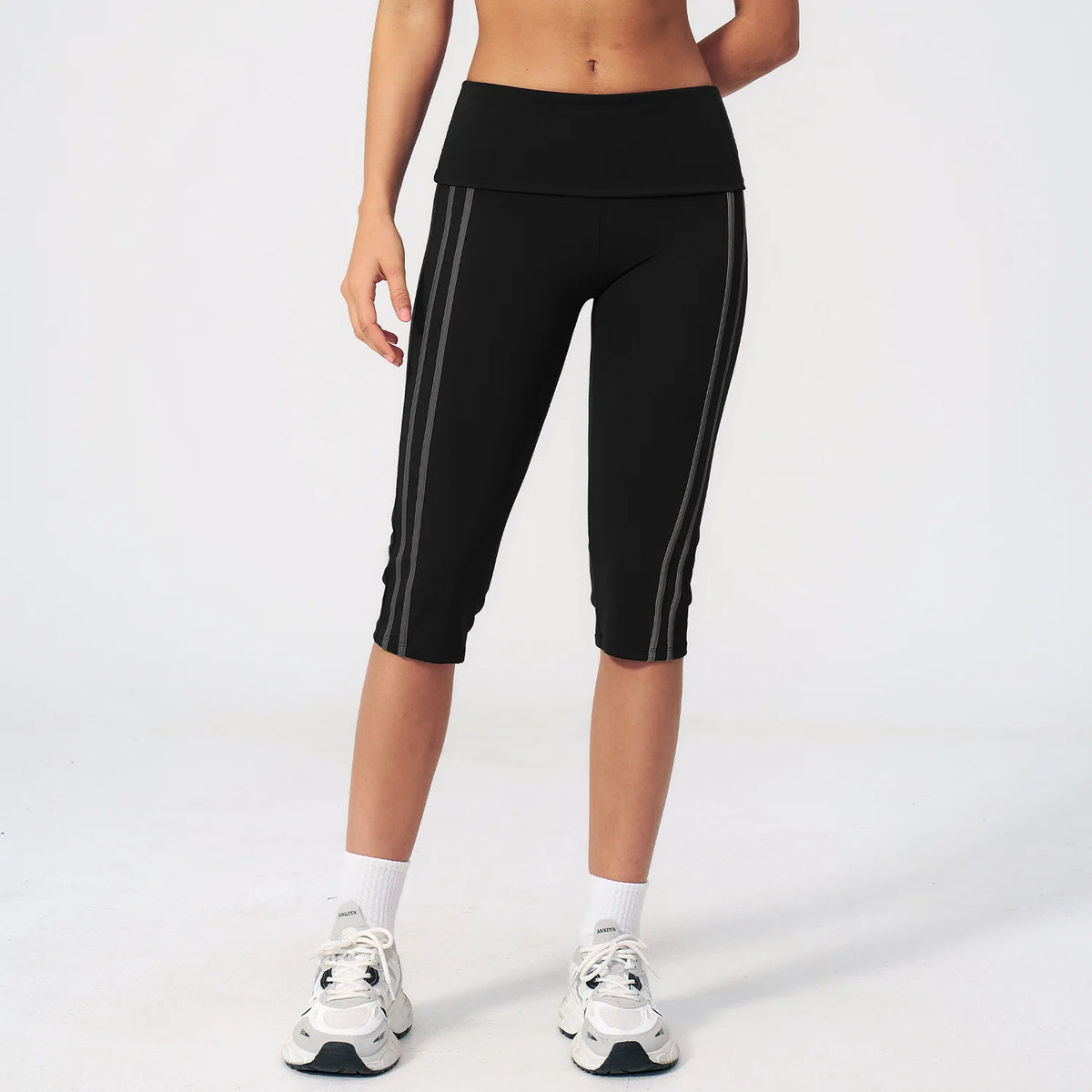 Moss green high-waist yoga capri leggings for women with a wide waistband, by Corporación Turística, shown on a plain background.