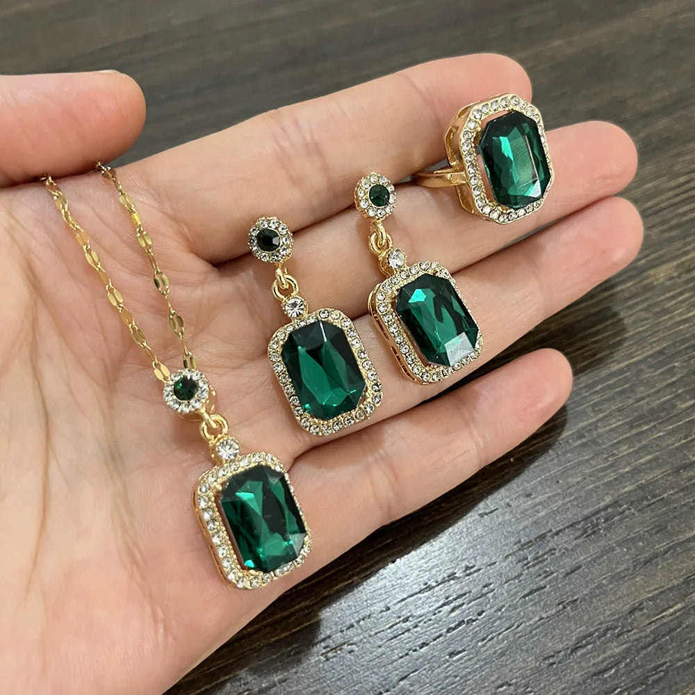 Elegant jewelry set including collar, earrings, and ring for women by Corporación Turística, featuring stylish and coordinated designs.