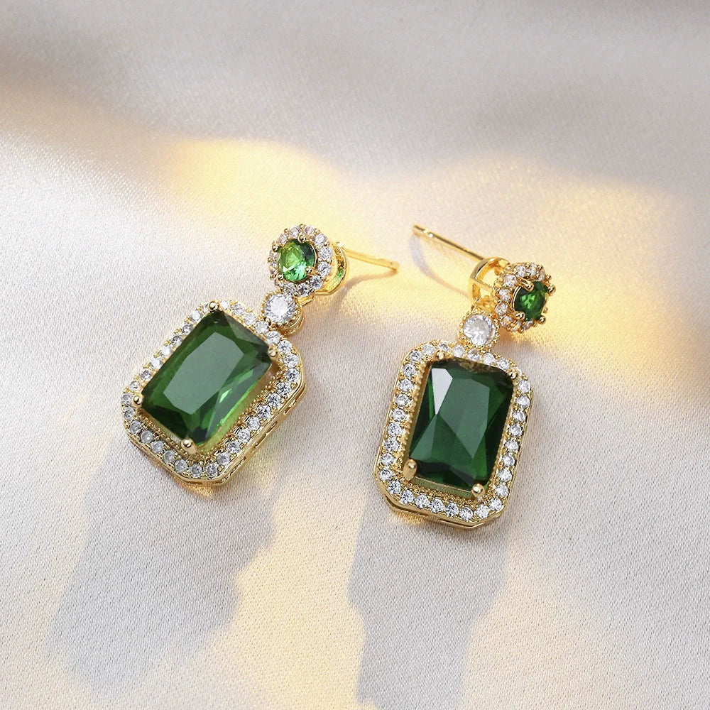 Set of jewelry including collar, earrings, and ring for women by Corporación Turística, featuring elegant gold-toned design.