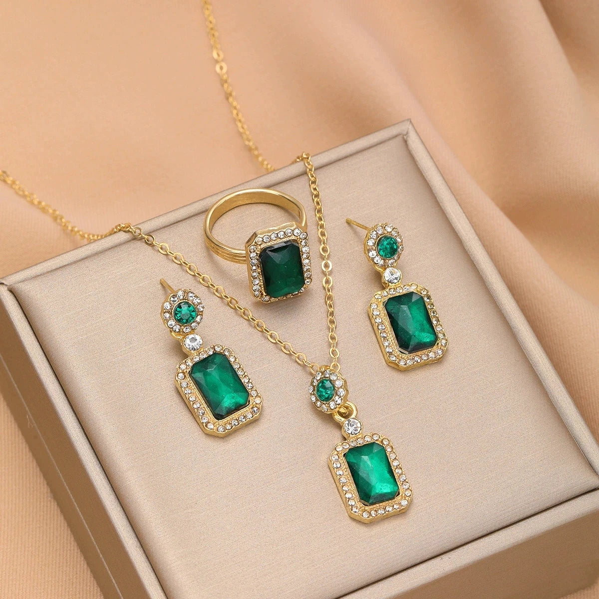 Set of jewelry including collar, earrings, and ring for women, featuring elegant designs by Corporación Turística.