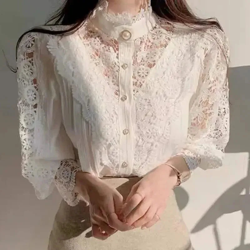 Orange lace blouse with petal sleeves for women, stylish shirt from Corporación Turística, shown on a hanger.