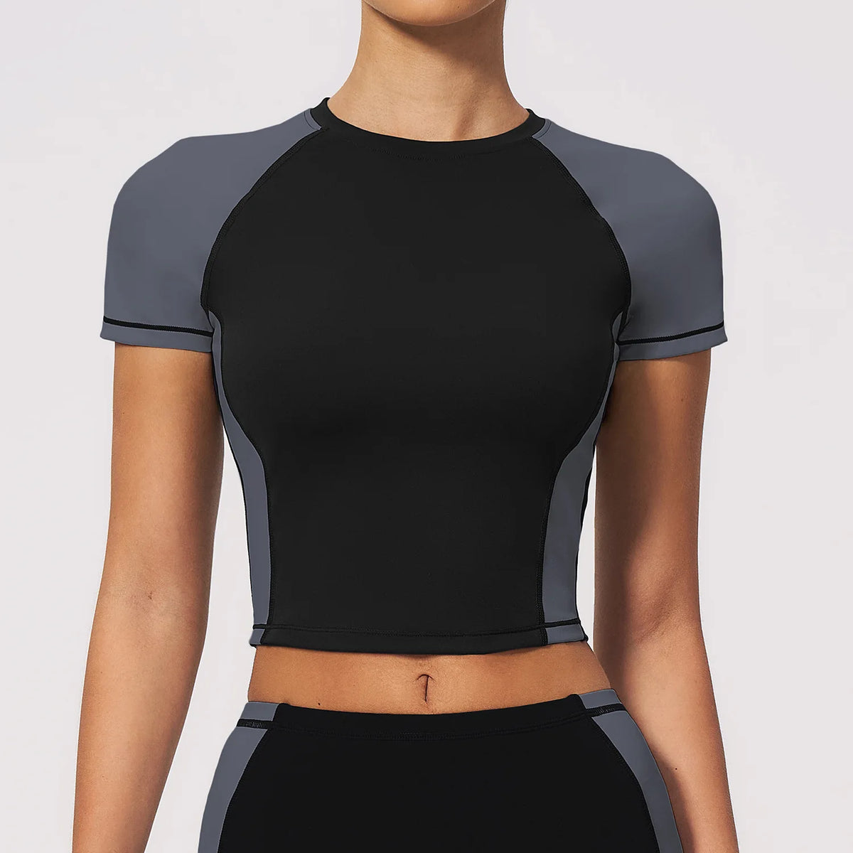 Navy blue breathable yoga T-shirt for women from Corporación Turística, designed for comfort and active wear.