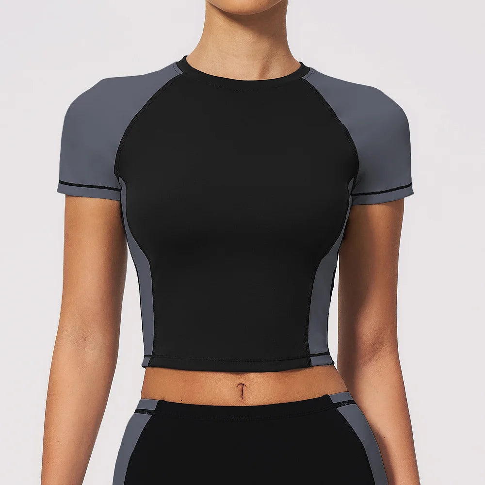 Navy blue breathable yoga T-shirt for women by Corporación Turística, made of lightweight, moisture-wicking fabric for comfortable exercise.