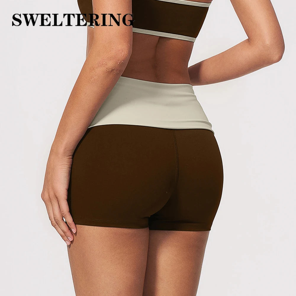 Navy blue women's yoga shorts with fold-over waistband from Corporación Turística, featuring a comfortable, stylish fit.