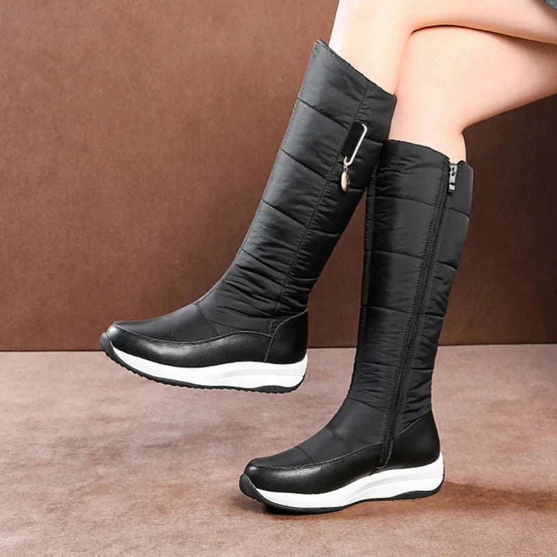 Black women's 2025 waterproof snow boots with plush lining from Corporación Turística, featuring a sturdy sole and warm interior.