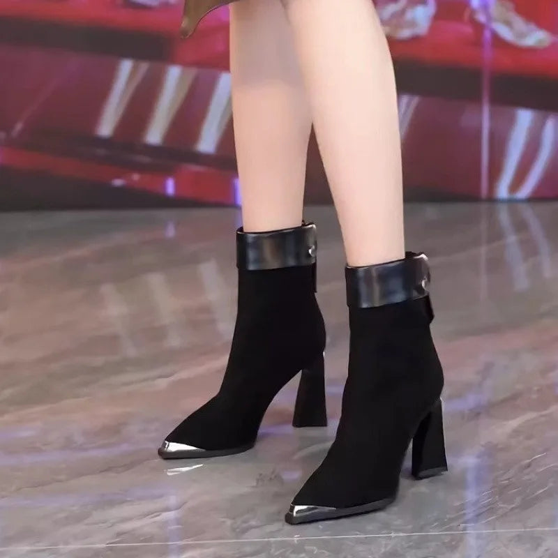 Black high-heeled lace-up ankle boots for women with pointed toes, stylish footwear from Corporación Turística.