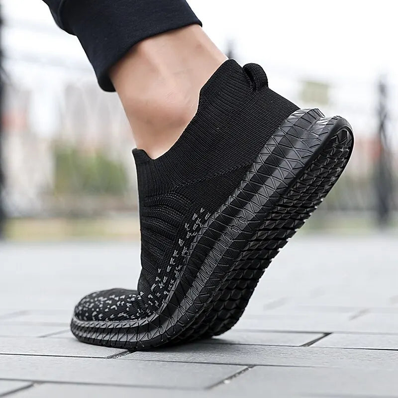 Black men's breathable sneakers by Corporación Turística, showing comfortable, lightweight design and casual style for everyday wear.