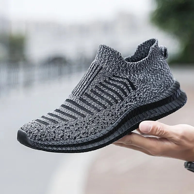 Black men's breathable sneakers by Corporación Turística, comfortable athletic shoes with breathable fabric for everyday wear.