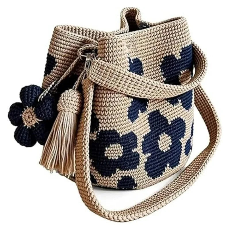 Handmade black crochet handbag with floral accents, crafted by Corporación Turística for a stylish and unique accessory.