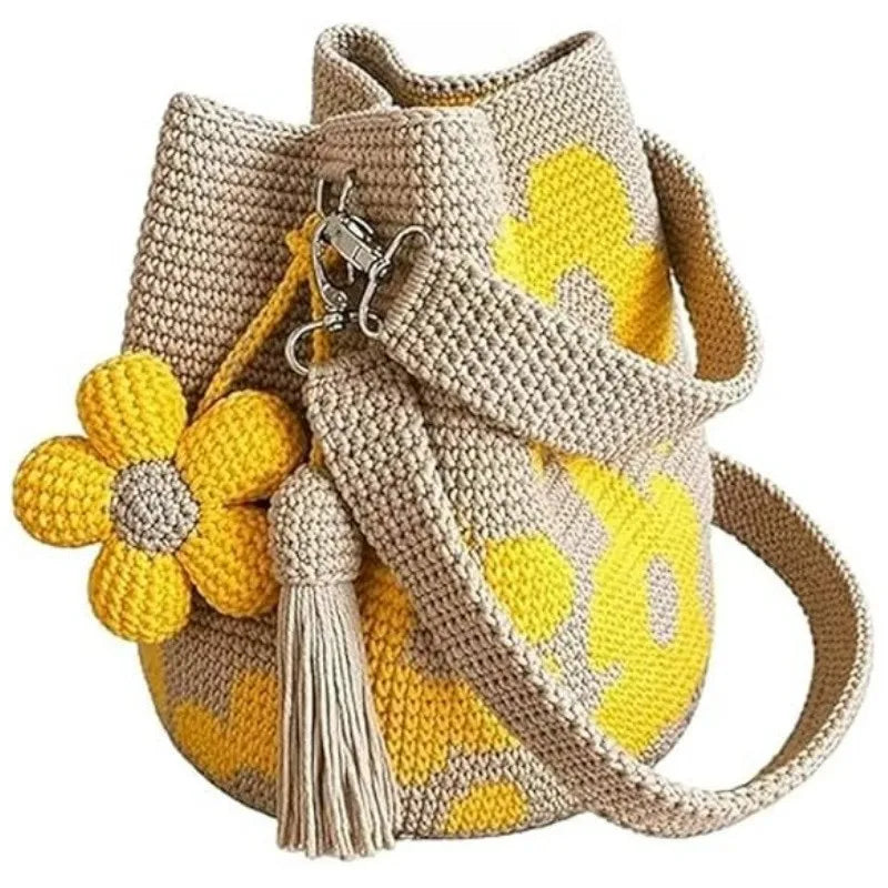Handmade black crochet handbag with floral details, crafted by Corporación Turística, featuring a stylish and unique design.