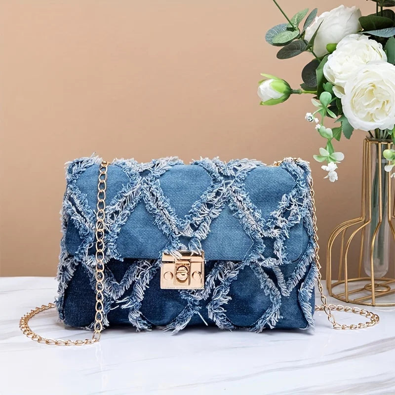Stylish black crossbody handbag by Corporación Turística, perfect for casual wear and pairing with jeans.