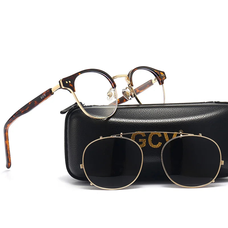 Black and gold GCV sunglasses with removable double-layer lenses, stylish design by Corporación Turística.