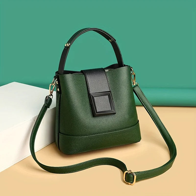Elegant black solid color bucket bag with adjustable shoulder strap from Corporación Turística, featuring a sleek, minimalist design.