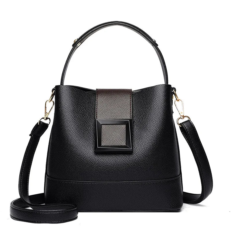 Elegant black solid color bucket bag with adjustable shoulder strap from Corporación Turística, stylish and versatile for daily use.