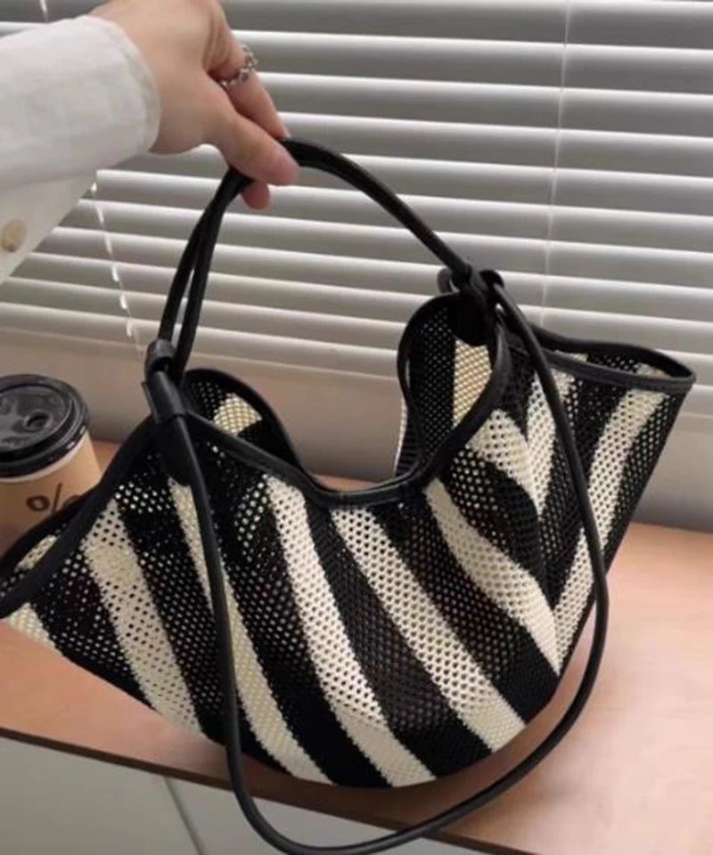 Highreal Forest crossbody bag by Corporación Turística, black faux leather with sloth design, stylish and functional for women.
