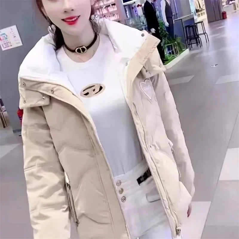 Black women's winter parka jacket by Corporación Turística, stylish and warm outerwear for cold weather.