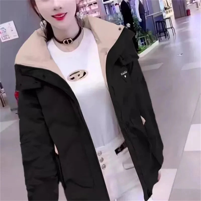 Black women's winter parka jacket from Corporación Turística, stylish and warm outerwear for cold weather.