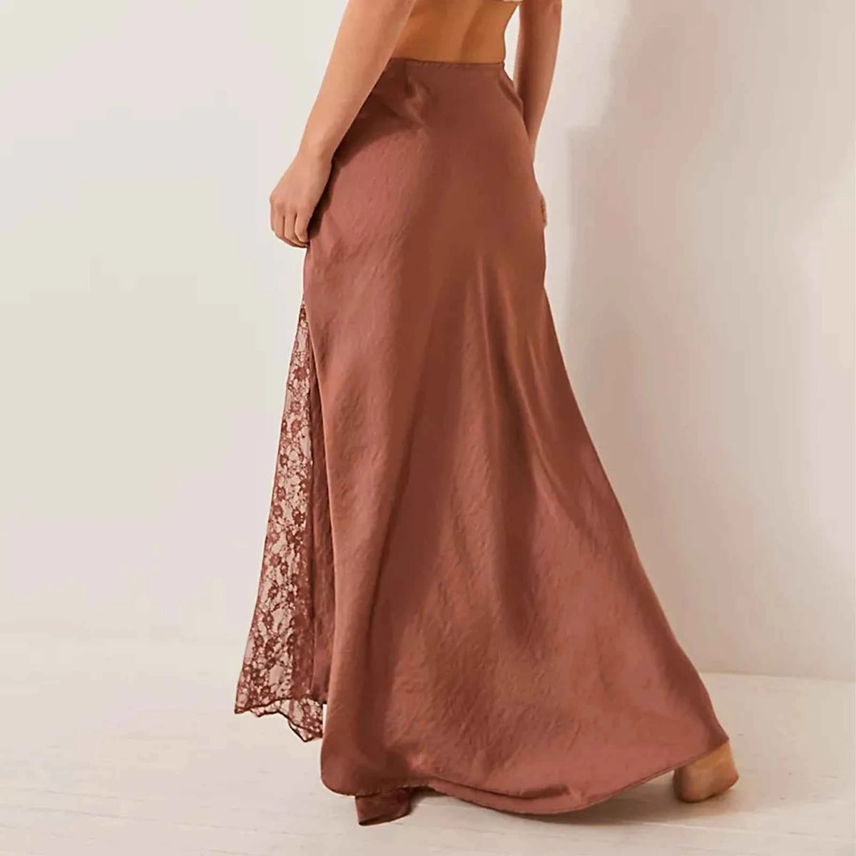Elegant black long skirt for women, smooth and plain, from Corporación Turística, perfect for formal or casual wear.