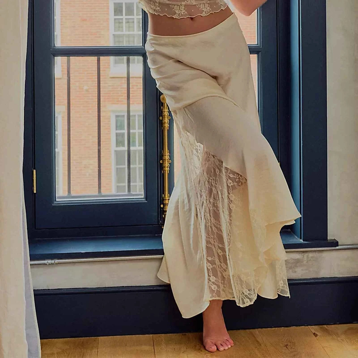 Elegant black long skirt for women by Corporación Turística, featuring a smooth, flowing design and high waist style.