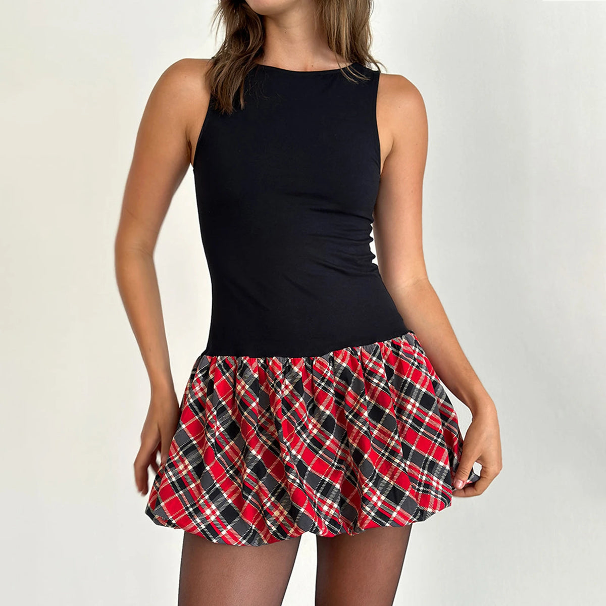 Black sleeveless minidress for women by Corporación Turística, close-up of fitted design and sleeveless style.